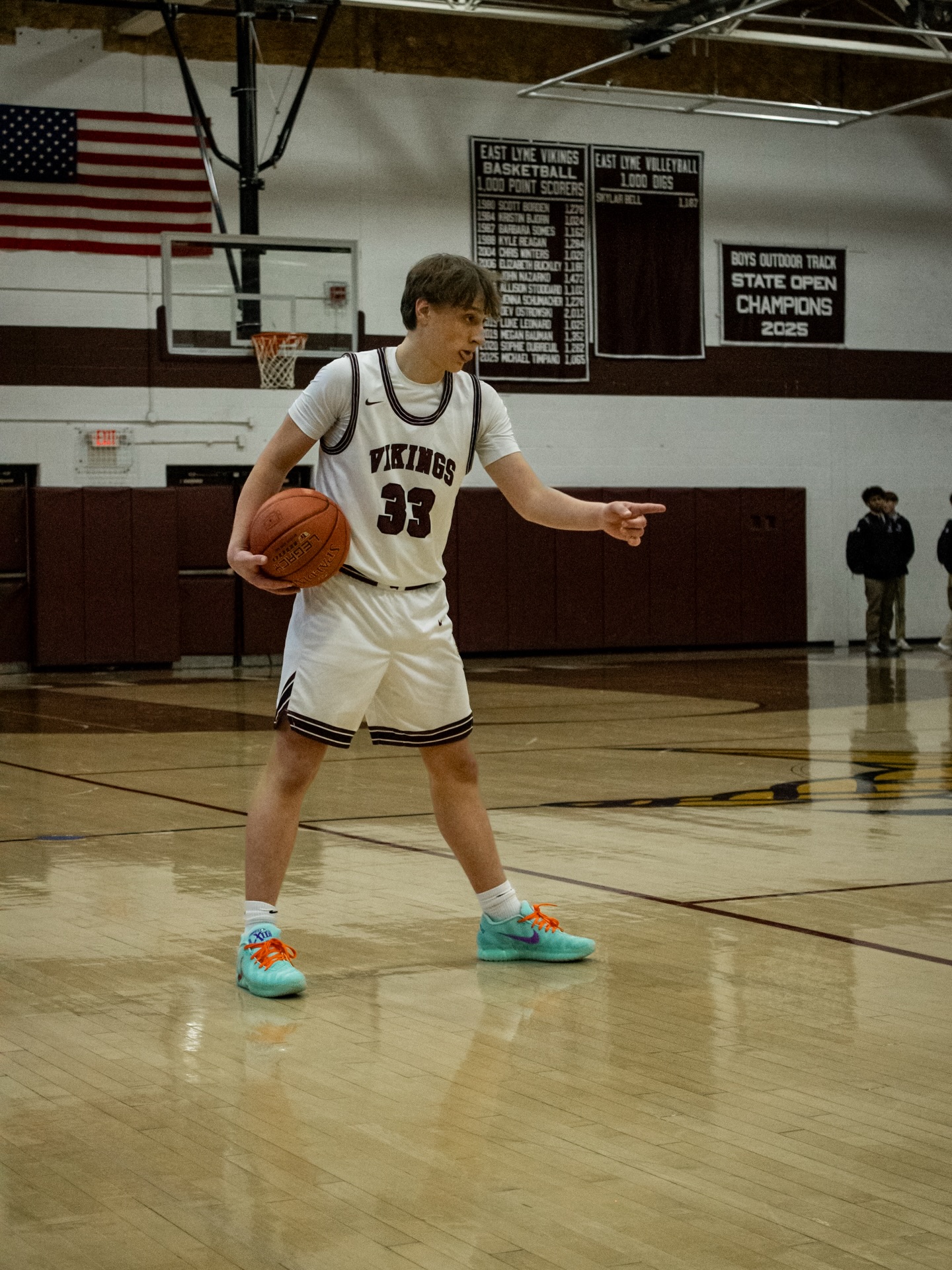 East Lyme number 33 directing the offense with the ball